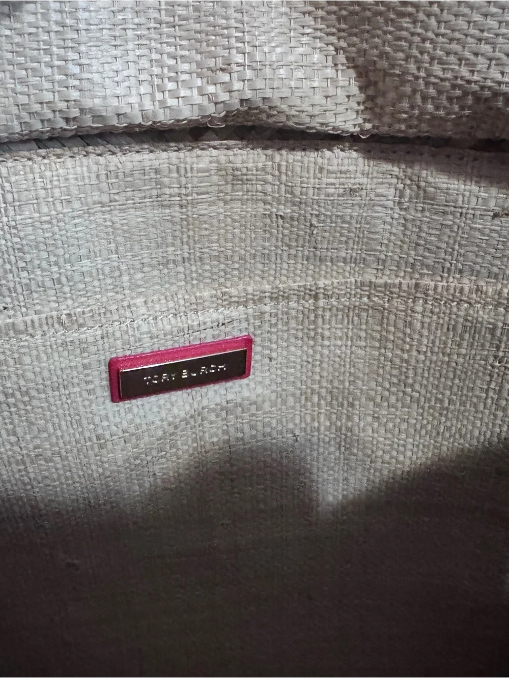 Tory Burch straw tote features vibrant red leather stripes